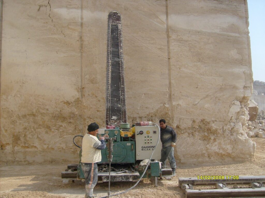 Chain arm cutting machine at a marble quarry