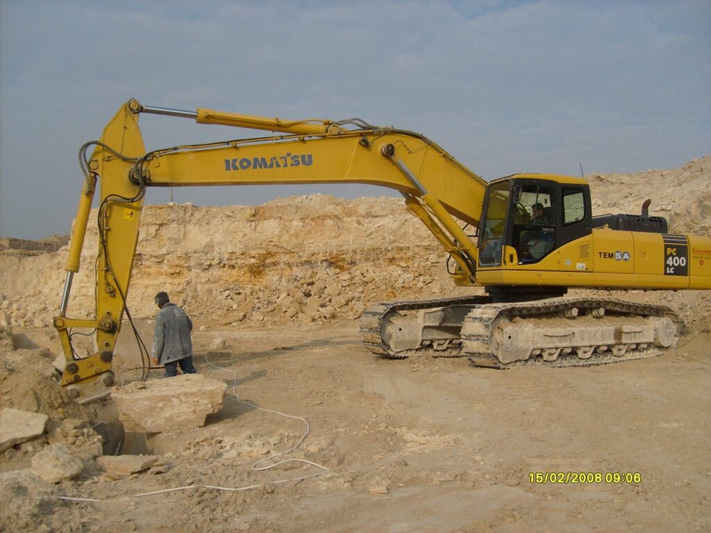 Excavator separating a marble block