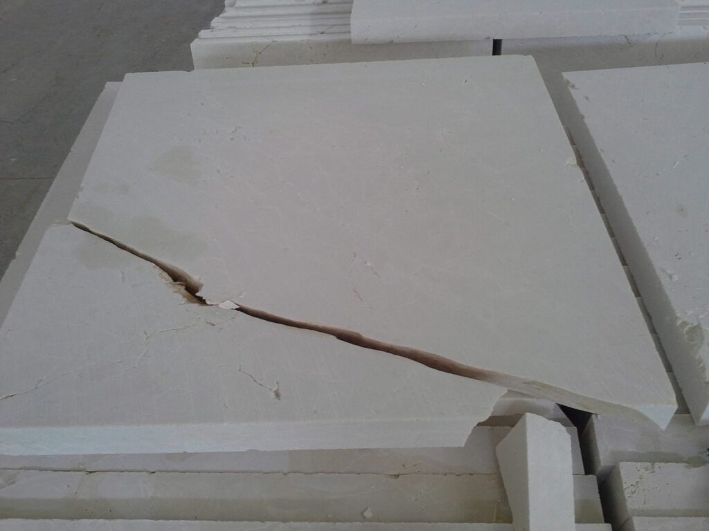 Crack running through a marble slab face