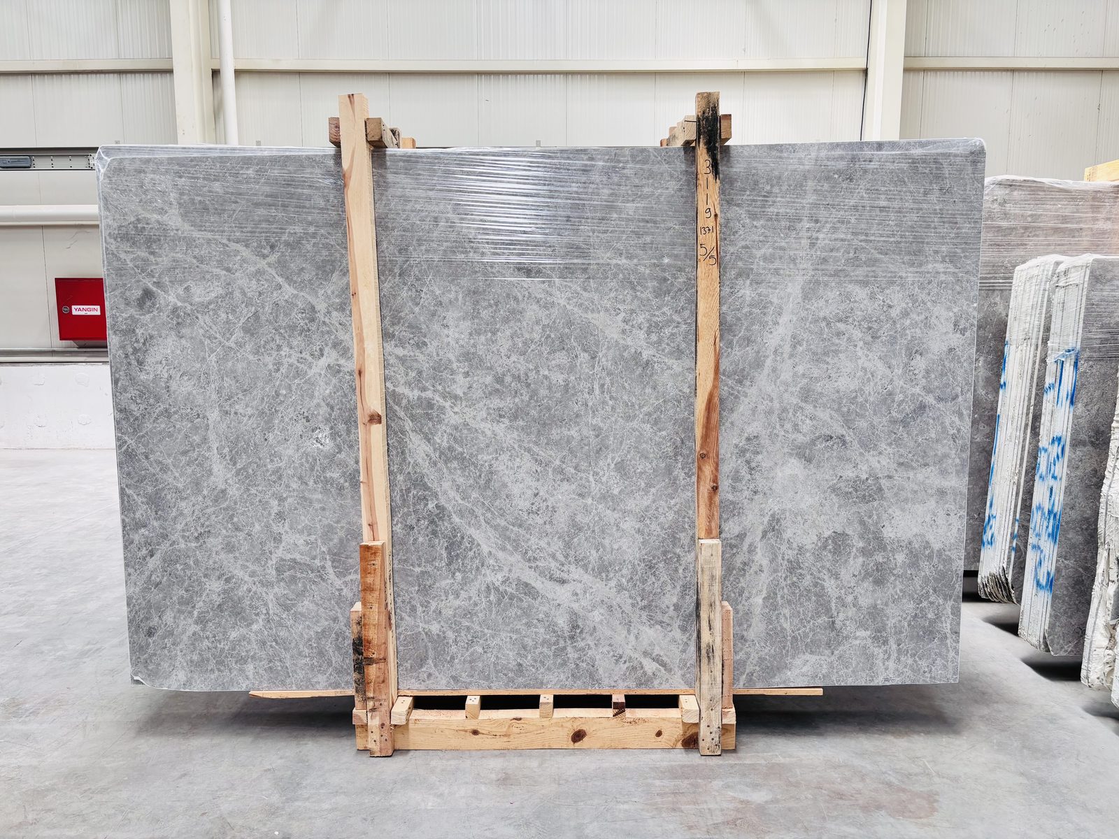 Tundra Grey marble slabs packed in a timber bundle ready for export