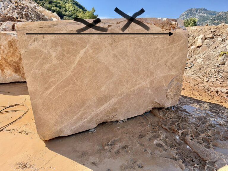 Marble block at a Turkish quarry with selection marks drawn on the block face