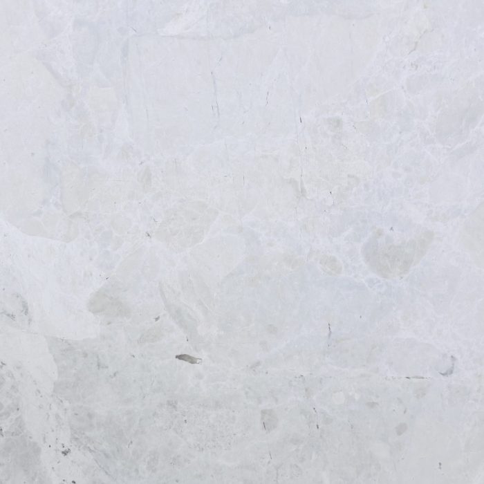 French Vanilla Turkish marble slab surface, white ground with a cloudy, patchy pattern and light pink clouds in places